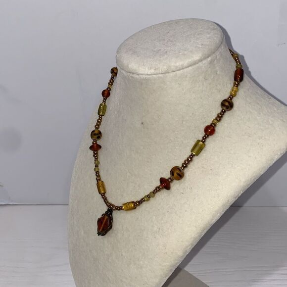Vintage Boho Beaded Necklace with Drop Dangle Caged Bead Brown and Gold Accents - Picture 3 of 11